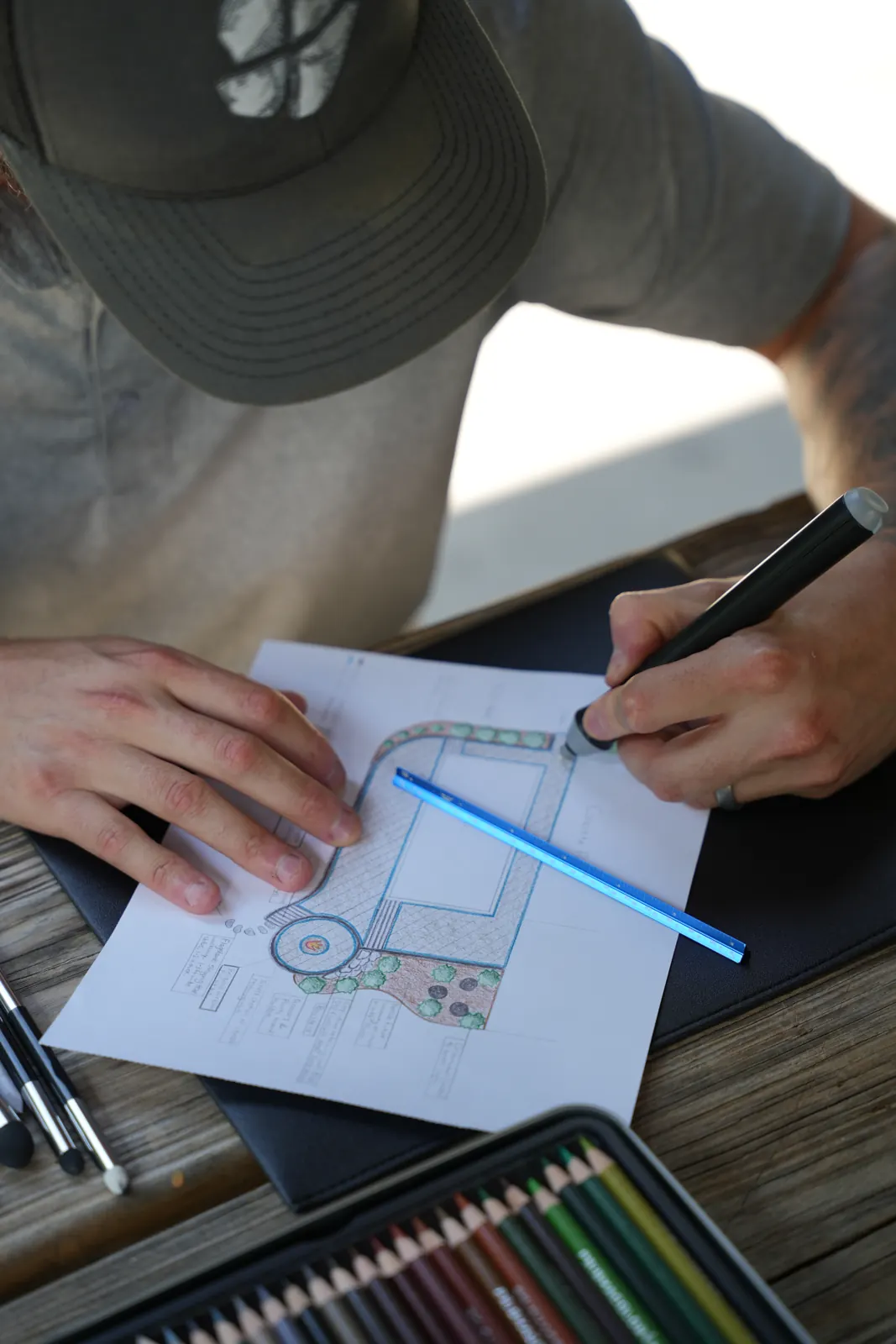Jacob drawing a plan by hand