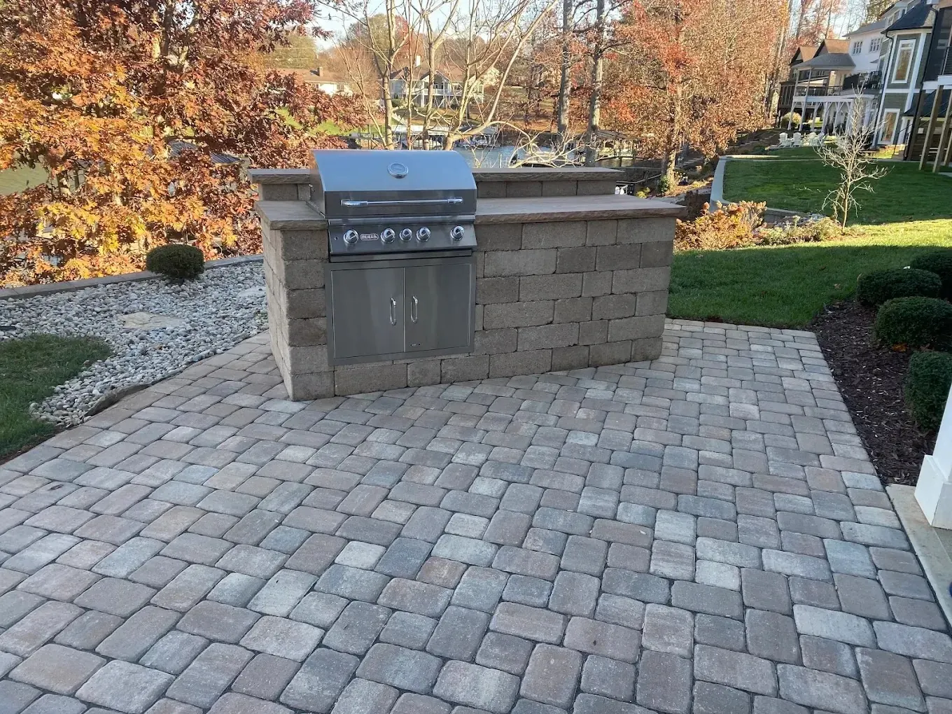A paver patio with a built-in outdoor kitchen