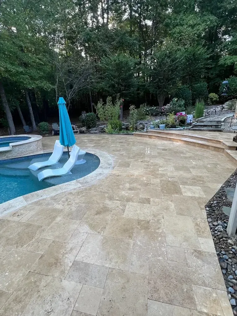 A travertine pool deck and patio on Lake Norman, finished